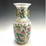 A large Chinese porcelain baluster vase, 20th century, painted with chickens, flowers and foliage,