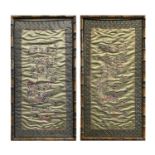 A pair of Chinese silk embroidered 'Hundred Boys' panels, early 20th century, frame size 68 x 36cm.