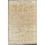 A Chobi rug of Ziegler design, the light brown field with a central lobed medallion, within a