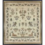 An early Victorian silk sampler, worked with birds, stags, flowers and potted plants by Agnes