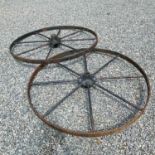 A pair of large iron implement wheels, 123cm diameter