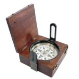 A 19th century travel compass with a printed card dial and a folding sight, 5.5cm square,