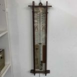 A Victorian oak cased Admiral Fitzroy barometer, with printed dials and scales, height 103cm.