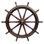 A large 19th century teak and brass ship's wheel with ten spokes the centre spoke with brass mount