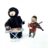 A Schuco clockwork tinplate clown violinist, height 11cm, together with a Japanese tinplate