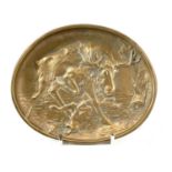 An early 20th century bronze oval dish cast with a moose attacking a wolf, width 14.5cm.