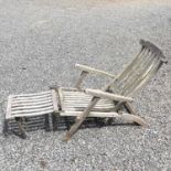 A teak folding garden steamer armchair with footrest