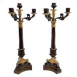 A pair of French Empire style gilt bronze candelabra, early 20th century, with a central nozzle