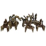 An African Kotoko bronze equestrian figure together with six other similar bronze equestrian
