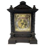 A German oak cased mantel clock, circa 1900, with Winterhalder and Hofmeier movement, the case