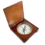 A 19th century compass with printed card dial in a square mahogany box with chamfered edges, 10cm