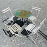 Four Folding bistro chairs and a circular table diameter 60.5cm.