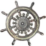 A brass mounted teak ship's wheel, with typical turned decoration, total diameter 61cm.