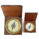 A 19th century travel compass of small proportions with a printed card dial in a square oak case,