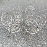 A set of four 1950s wrought steel conservatory chairs