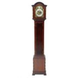 An Edwardian mahogany three train grandmother clock, the brass arched dial inscribed 'Tempus Fugit',