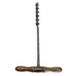 A 19th century blacksmith made wrought iron hand auger, with ash handle, length 49cm.