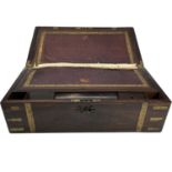 A Victorian rosewood and brass bound writing box, with a fitted interior and three concealed