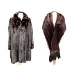 A Black Diamond 3/4 fur coat and a matching fur shawl. (2)There are no condition issues.The coat