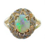 An 18ct gold diamond and white opal dress ring,