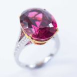 An 18ct white and yellow gold pink topaz dress ring.