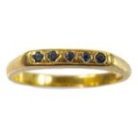 An 18ct gold sapphire set five stone ring.