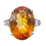 An 18ct white gold citrine and diamond dress ring.