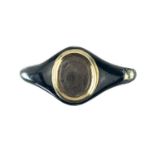 An early Victorian gold and black enamel mourning signet ring.