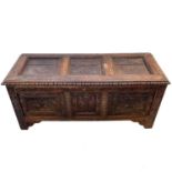 A carved oak joined chest, substantially 17th century.