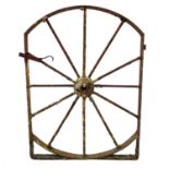 A cast iron gate in the form of a wheel.