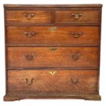 A George III oak chest of drawers.