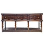 An oak low dresser, early 18th century,