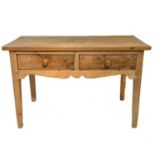 A stripped pine side or serving table, 19th century.