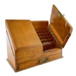 A late Victorian oak stationery cabinet.