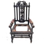 A Victorian carved stained oak open armchair.