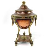 A Regency copper and brass tea urn.