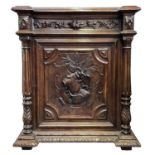 A Victorian carved oak side cabinet.