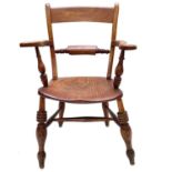 A beech and elm kitchen armchair, 19th century.