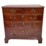 A George III oak chest of drawers.