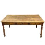 A fruitwood kitchen table, 19th century.