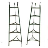 Two wrought iron green-painted triangular pan stands,