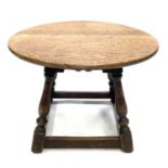 An oak circular low table, circa 1920's.