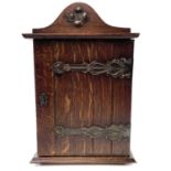 An oak smokers cabinet, early 20th century.
