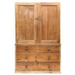 A Victorian pine linen press, with a pair of panelled doors.