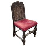 A carved oak side chair, early 18th century.