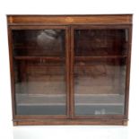 An Edwardian mahogany and inlaid bookcase, with two glazed doors, height 110cm, width 120cm, depth