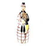 An Art Deco Robj, Paris, porcelain decanter/flask and cover, modelled as a Scottish Bagpiper, height