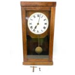 A Gledhill-Brook oak case glazed time recorder wall clock, fitted with a fusee movement,