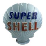 A blue glass 'Super shell' petrol pump globe, height 45cm. Originally from Cowls & Sons Garage,