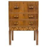 An Art Deco walnut and inlaid secretaire chest by Judith E. Hughes, of small proportions, the